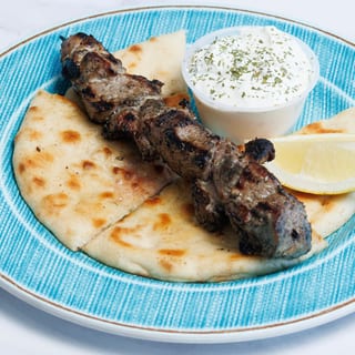 (1) PORK SOUVLAKI SKEWER W/ PITA & TZATZIKI
